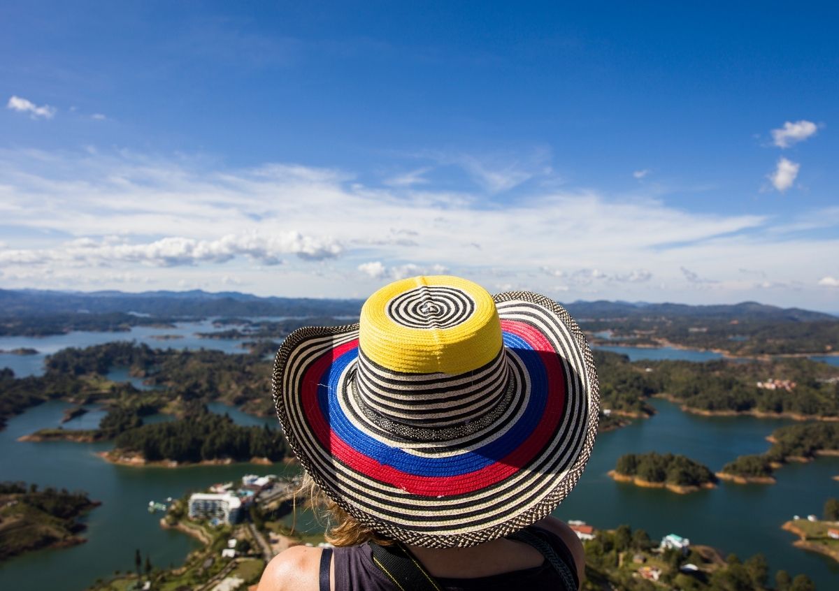 Young Woman at Guatape Lake in Antioquia, Colombia - evanto