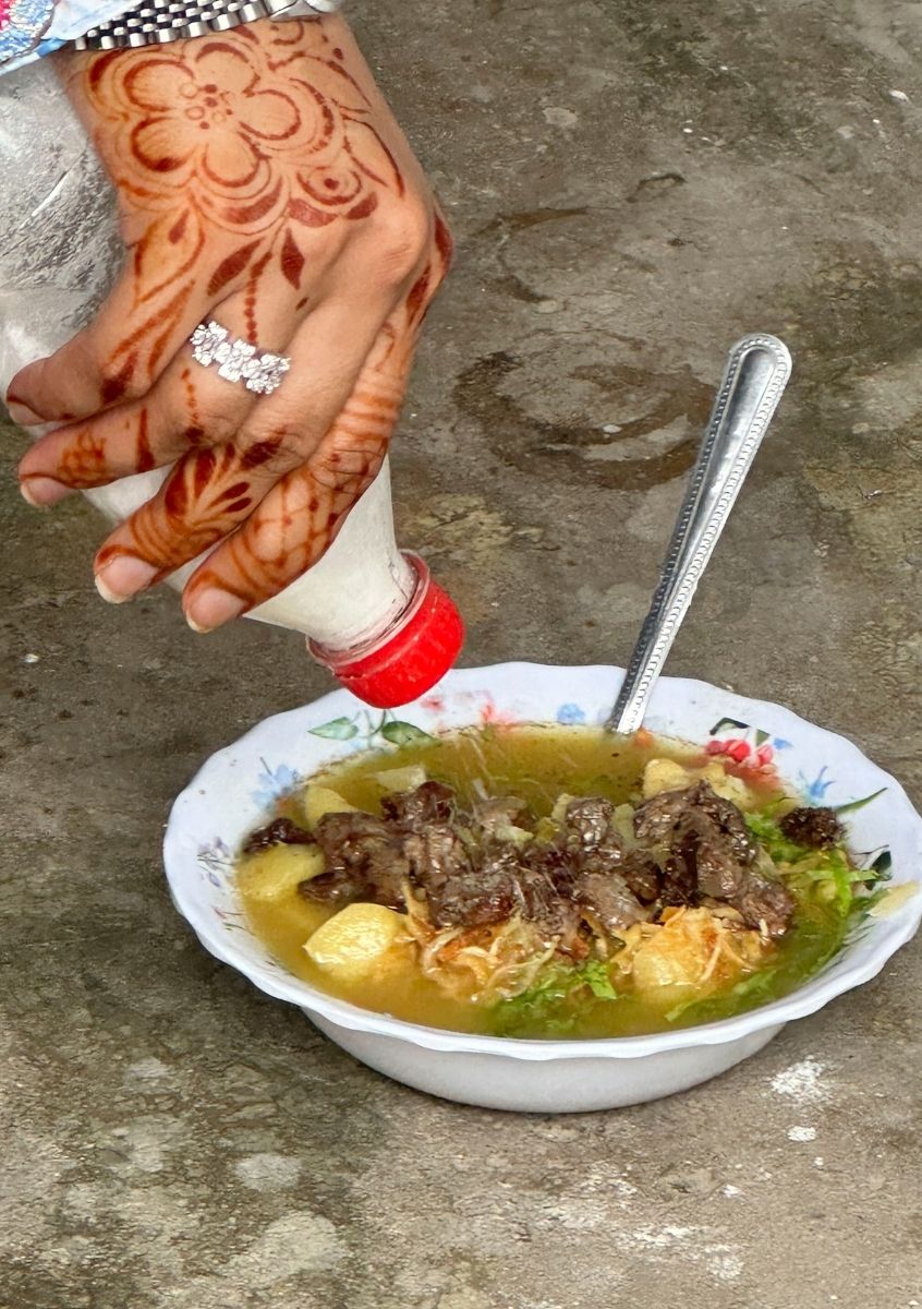 enjoying Urojo Soup (Zanzibar Mix) in Zanzibar