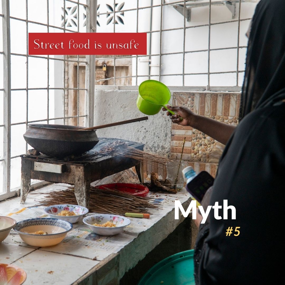 Zanzibari streetfood vendor roasting meat skewers