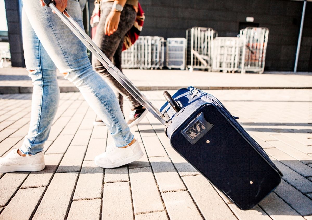 Woman pulling luggage